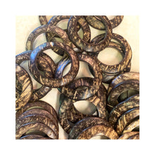 Load image into Gallery viewer, The rings that hold the feathers together is made of coconut shell which gives off a gorgeous pattern.