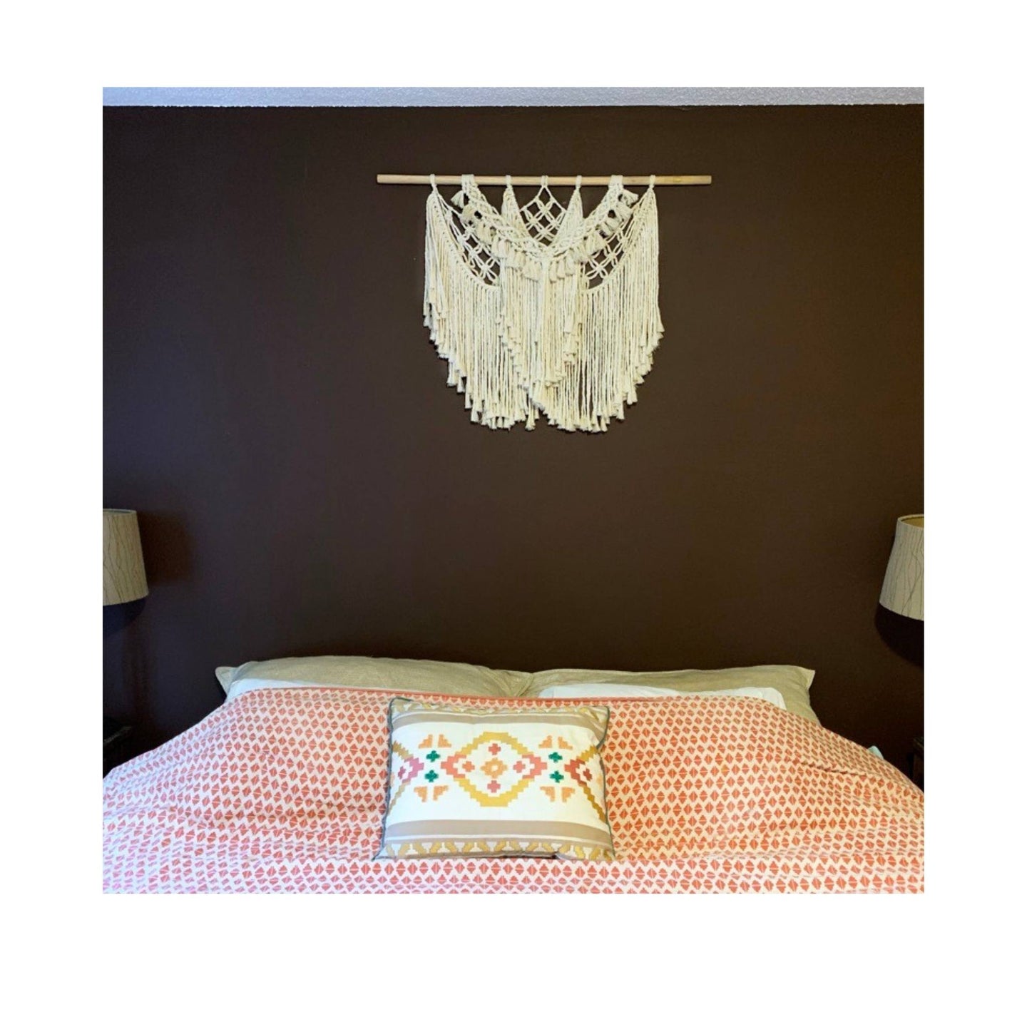 This macrame fiber art Resilient looks gorgeous over this king bed
